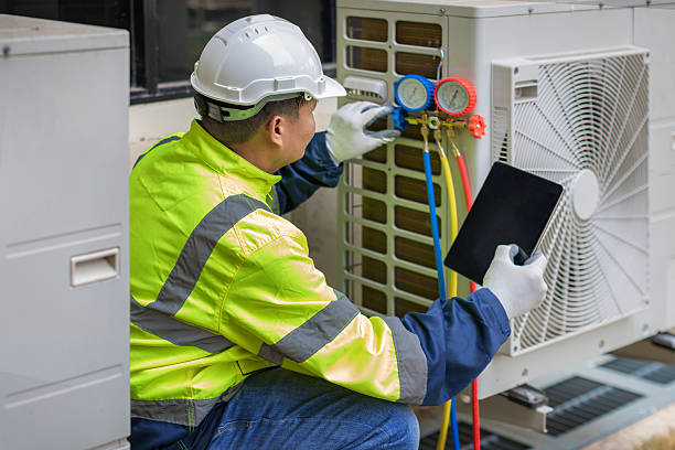 Professional Emergency Ac Repair technician working in Wiggins, CO